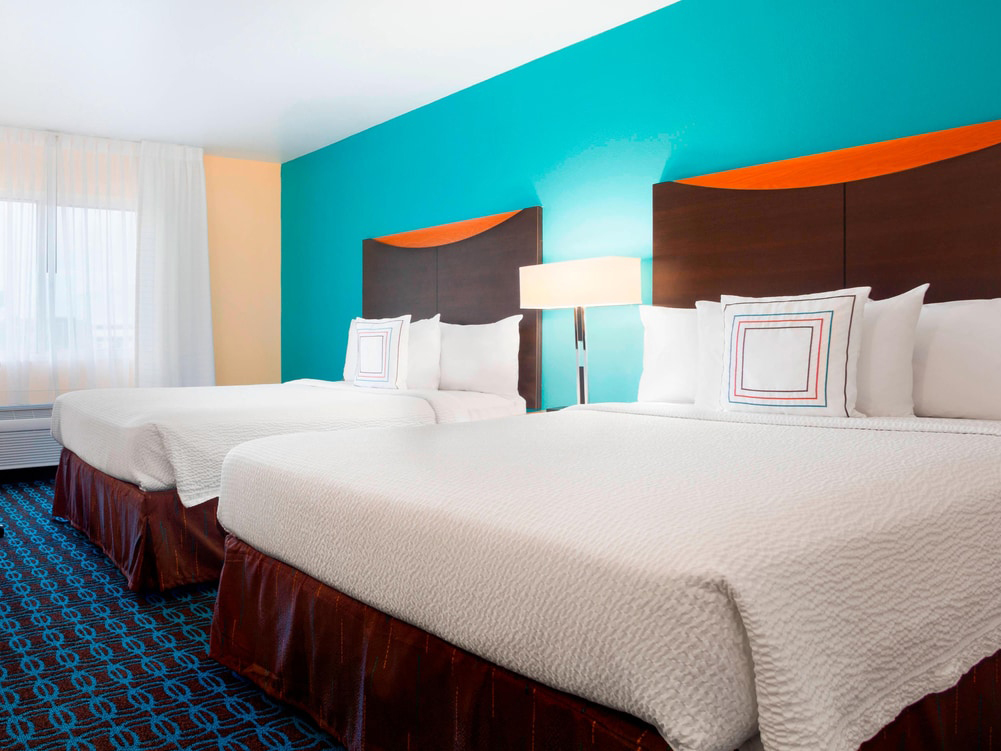 A room with two queen beds as the Sonesta Essential Houston Energy Corridor hotel.