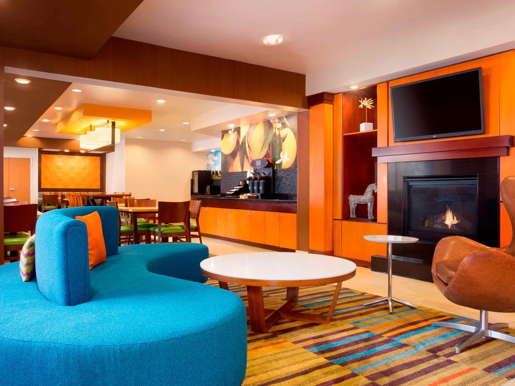 A seating area in the lobby of the Sonesta Essential Houston Energy Corridor hotel.