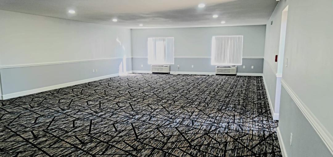 empty carpeted room for meetings or events