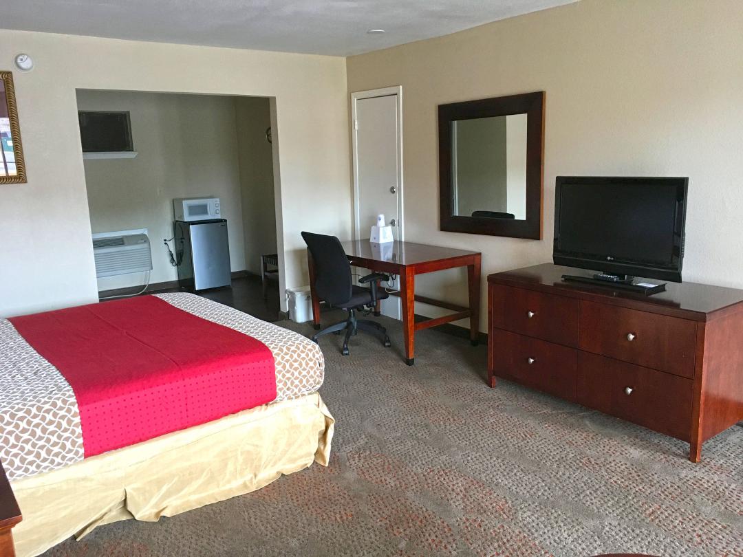 One king bed with flat screen TV, desk and chair