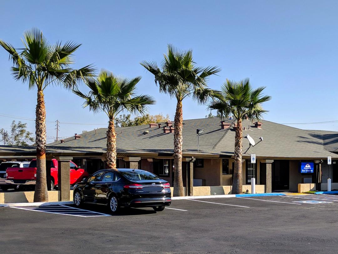 Front office exterior with palm trees