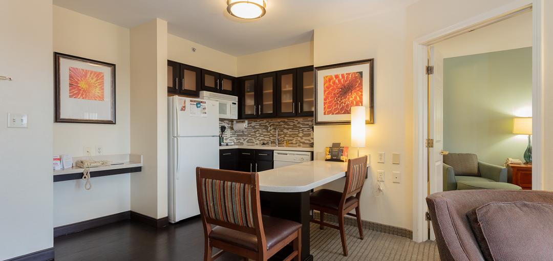 The kitchen area of a room at the Sonesta Anaheim Resort Area hotel.