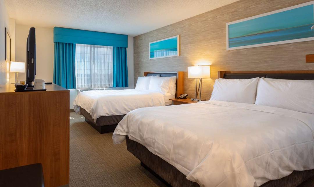 A room with two beds at the Sonesta Anaheim Resort Area hotel.