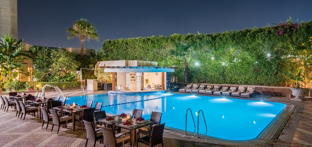 The outdoor pool at night at Sonesta Hotel, Tower & Casino - Cairo.