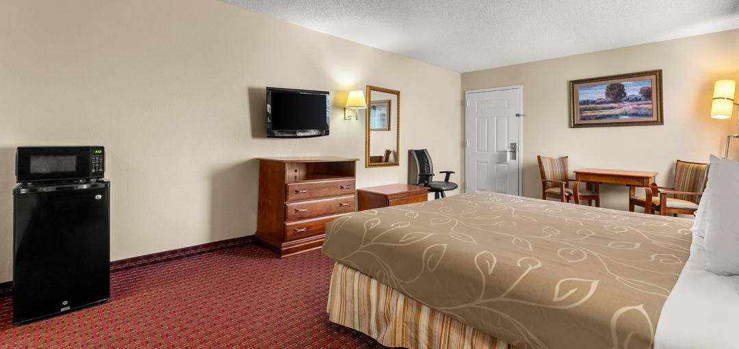 Americas Best Value Inn Montezuma king bed guest room features image