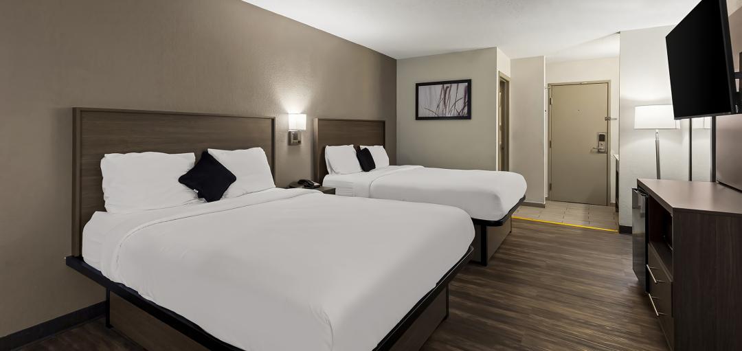 A Double Queen guestroom at the Red Lion Inn & Suites Caseyville hotel.