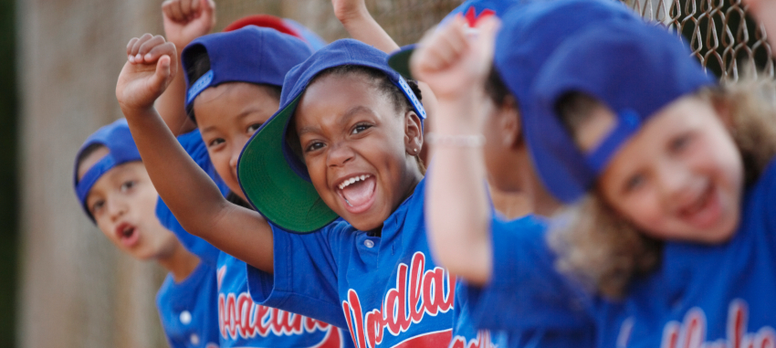 Kids baseball team cheering - group travel image
