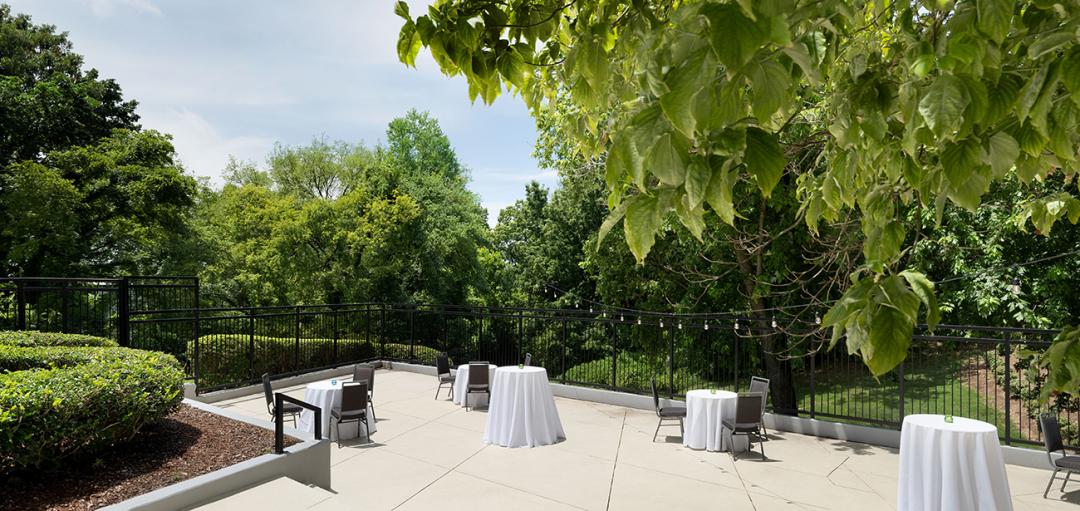 Outdoor meeting area with a lush green scenery.