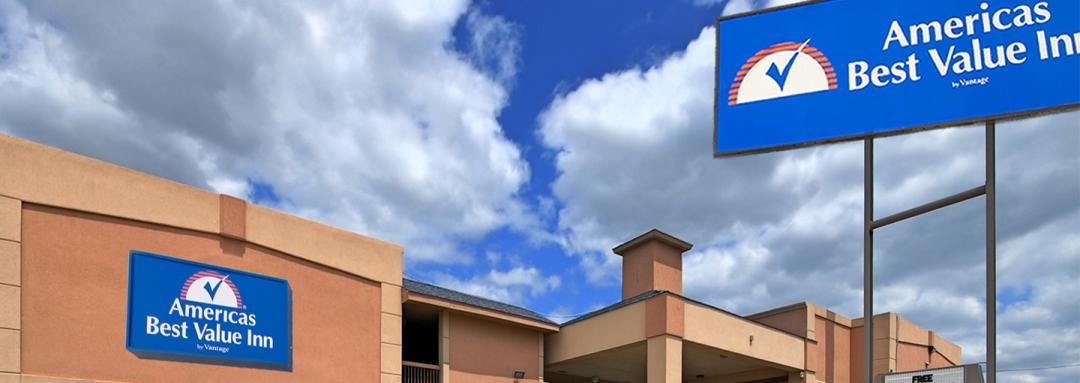 Hotel exterior with sign in sunny sky