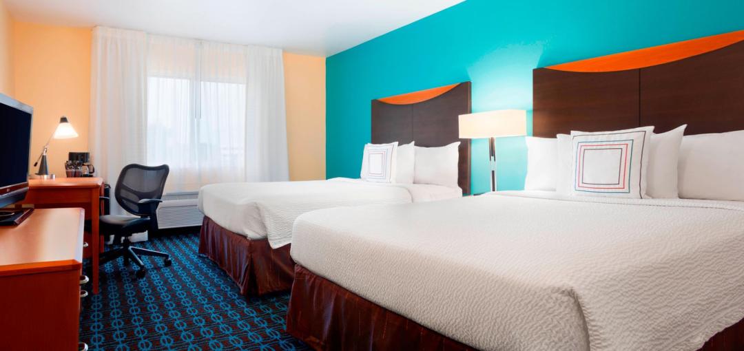 A room with two queen beds at the Sonesta Essential Houston Energy Corridor hotel.