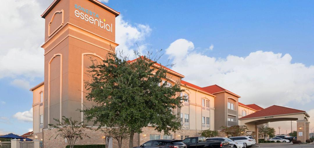 The front, exterior and entrance of the Sonesta Essential Houston Westchase hotel.