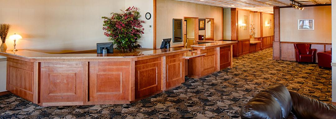 Large front desk with lobby seating